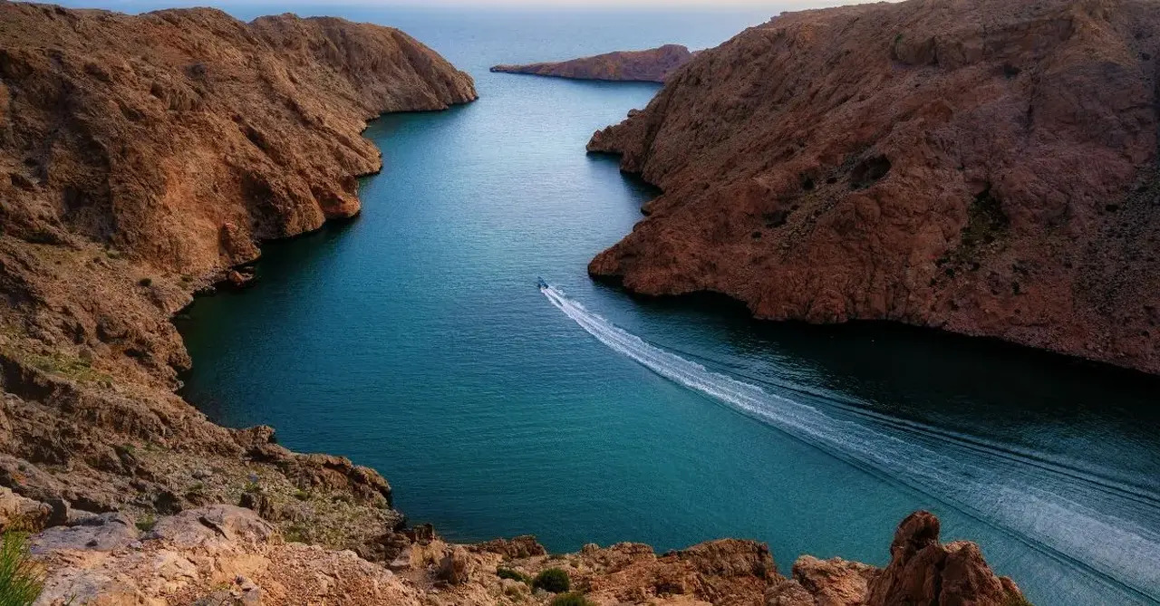 Aerial view of Muscat showing mountains meeting the sea