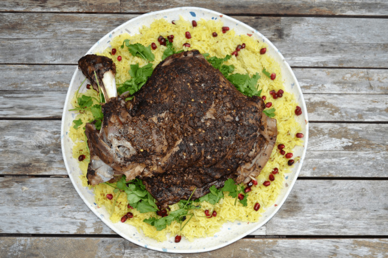 Traditional Omani shuwa dish with meat and rice